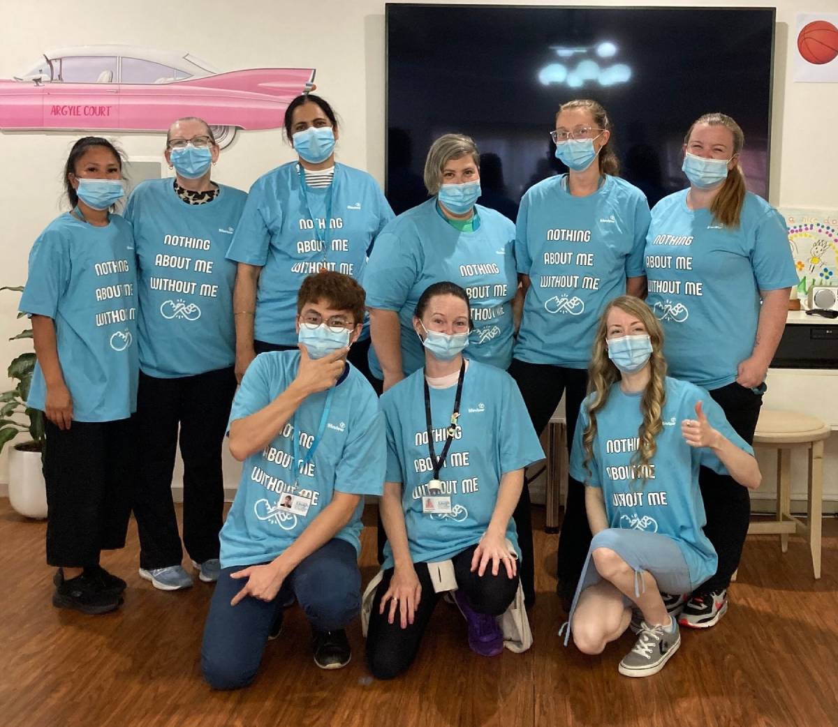 Pictured below: Staff at Lifeview Argyle Court, Chelsea, proudly don their Nothing About Me Without Me t-shirts after being presented with them by the residents.